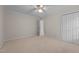 Bedroom with neutral carpet, a ceiling fan, a window, and a closet at 804 Warwick Ct, Burlington, NC 27215