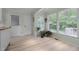 Bright breakfast nook featuring large windows, tile flooring, and access to the outdoors at 804 Warwick Ct, Burlington, NC 27215