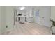 Well-lit kitchen boasts stainless steel appliances, white cabinetry, a center island, and modern finishes at 804 Warwick Ct, Burlington, NC 27215