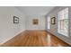 Spacious living room with hardwood floors, large windows, and neutral paint, creating a bright, airy atmosphere at 804 Warwick Ct, Burlington, NC 27215