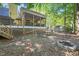 Backyard featuring a patio, stairs, shed, and fire pit is ideal for outdoor gatherings and relaxation at 829 Joyner Ct, Wake Forest, NC 27587