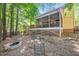 Backyard featuring a patio, stairs, and fire pit is ideal for outdoor gatherings and relaxation at 829 Joyner Ct, Wake Forest, NC 27587