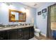 Bathroom with a double sink vanity, granite countertops, and light blue walls at 829 Joyner Ct, Wake Forest, NC 27587