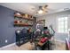A unique bedroom is arranged as a home office with decor and storage for personal treasures at 829 Joyner Ct, Wake Forest, NC 27587