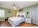 Comfortable bedroom with hardwood floors, a ceiling fan, and natural light from a window at 829 Joyner Ct, Wake Forest, NC 27587