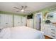 Spacious bedroom features hardwood floors, a ceiling fan, and a wall of closets at 829 Joyner Ct, Wake Forest, NC 27587