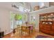 Bright dining area featuring a bay window, hardwood floors, and traditional furniture at 829 Joyner Ct, Wake Forest, NC 27587