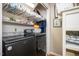 Well-equipped laundry room with modern washer and dryer, shelving, and storage space at 829 Joyner Ct, Wake Forest, NC 27587