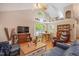 Bright living room with vaulted ceilings, hardwood floors, and combination dining area at 829 Joyner Ct, Wake Forest, NC 27587