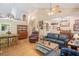 Open-concept living room with hardwood floors, fireplace, and traditional furnishings at 829 Joyner Ct, Wake Forest, NC 27587