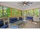 Relaxing screened-in porch with comfortable seating and a view of the wooded backyard at 829 Joyner Ct, Wake Forest, NC 27587