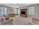 Large bonus room with carpet, media center, and multiple windows at 1012 Wandering Way, Rolesville, NC 27571