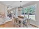 Bright dining area with hardwood floors, natural light, and modern chandelier at 1012 Wandering Way, Rolesville, NC 27571