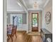 Elegant foyer with hardwood floors, a chandelier, and access to the dining room at 1012 Wandering Way, Rolesville, NC 27571