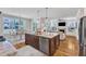 Gourmet kitchen with a large island, granite countertops, stainless steel appliances, and an open-concept design at 1012 Wandering Way, Rolesville, NC 27571