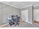 Home office with gray walls, crown molding, neutral carpet, and closet at 1012 Wandering Way, Rolesville, NC 27571