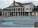 Community pool with seating, gazebo, and stunning architectural design at 1012 Wandering Way, Rolesville, NC 27571