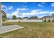 This backyard features a lush lawn and white vinyl fence at 1013 Fieldmere Pl, Wendell, NC 27591