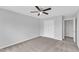A neutral bedroom with a ceiling fan and closet, offering a blank canvas for personalization and restful retreat at 1013 Fieldmere Pl, Wendell, NC 27591