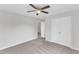 This bedroom features neutral-colored walls, carpet, a ceiling fan and closet at 1013 Fieldmere Pl, Wendell, NC 27591