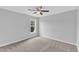 A neutral bedroom with a ceiling fan, carpet, and a window, creates a relaxing atmosphere at 1013 Fieldmere Pl, Wendell, NC 27591