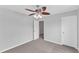 This bedroom features neutral-colored walls, carpet, a ceiling fan and closet at 1013 Fieldmere Pl, Wendell, NC 27591