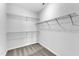 Walk-in closet featuring wire shelving and neutral carpeting at 1013 Fieldmere Pl, Wendell, NC 27591