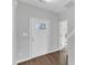 Bright entryway featuring wood-look floors and a white door with glass panels at 1013 Fieldmere Pl, Wendell, NC 27591