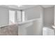 A bright hallway with neutral walls, carpet, and white trim leads to multiple rooms in the home at 1013 Fieldmere Pl, Wendell, NC 27591