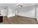 Spacious living room with hardwood floors, neutral paint, and a ceiling fan for comfortable living at 1013 Fieldmere Pl, Wendell, NC 27591