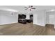 Open-concept living area with a kitchen featuring modern appliances and stylish countertops, perfect for entertaining at 1013 Fieldmere Pl, Wendell, NC 27591