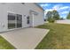 This outdoor patio features concrete and leads to a sliding glass door to the home at 1013 Fieldmere Pl, Wendell, NC 27591