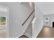 Carpeted staircase with a wood railing leading to the upper level of the home at 1013 Fieldmere Pl, Wendell, NC 27591