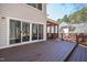 Spacious, stained-wood back deck provides ample space for outdoor relaxation and entertaining with sliding glass doors at 103 Tremont Cir, Chapel Hill, NC 27516