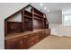 Finished basement with custom cabinets, shelving, and drawers at 103 Tremont Cir, Chapel Hill, NC 27516