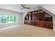 Finished basement featuring custom built-in cabinets and shelving at 103 Tremont Cir, Chapel Hill, NC 27516