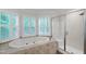 Bright bathroom featuring a tub with jets next to a glass-enclosed shower at 103 Tremont Cir, Chapel Hill, NC 27516