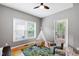 Cozy ' bedroom with hardwood floors, a ceiling fan, and natural light at 103 Tremont Cir, Chapel Hill, NC 27516