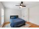 Comfortable bedroom with a ceiling fan, hardwood floors and shutters at 103 Tremont Cir, Chapel Hill, NC 27516