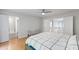 Bright bedroom with hardwood floors, bench, and ensuite bathroom access at 103 Tremont Cir, Chapel Hill, NC 27516