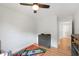Bedroom featuring a ceiling fan, light grey walls, and wood flooring at 103 Tremont Cir, Chapel Hill, NC 27516