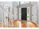 Inviting foyer with wood floors, staircase, and entry door with sidelights at 103 Tremont Cir, Chapel Hill, NC 27516