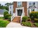 Beautiful home with brick front, manicured landscaping, and welcoming entrance at 103 Tremont Cir, Chapel Hill, NC 27516