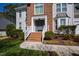 Inviting home featuring brick facade, a welcoming entrance, and well-maintained landscaping at 103 Tremont Cir, Chapel Hill, NC 27516