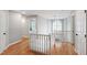 Spacious second-story hallway with wood floors, white trim, and natural light at 103 Tremont Cir, Chapel Hill, NC 27516
