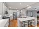 Bright kitchen with marble countertops, white cabinets, and stainless steel appliances at 103 Tremont Cir, Chapel Hill, NC 27516