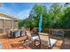 Spacious back deck, featuring ample outdoor seating and lush backyard views at 106 Mesquite Dr, Durham, NC 27703