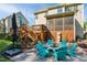 Backyard features fire pit seating, an outdoor kitchen, and screened in patio at 106 Mesquite Dr, Durham, NC 27703