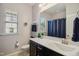 Updated bathroom with modern fixtures, a vanity with storage, and ample natural light at 106 Mesquite Dr, Durham, NC 27703