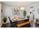 Elegant dining room with a modern light fixture, stylish decor, and ample seating for gatherings at 106 Mesquite Dr, Durham, NC 27703